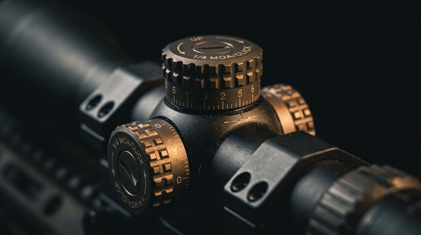 Close-up of a rifle scope adjustment turret