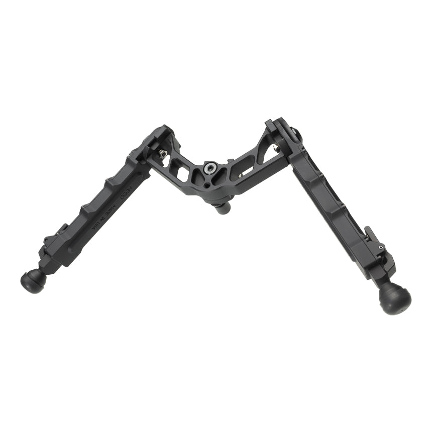 Accu-Tac LP-50 low-profile bipod in black with its legs spread for prone shooting