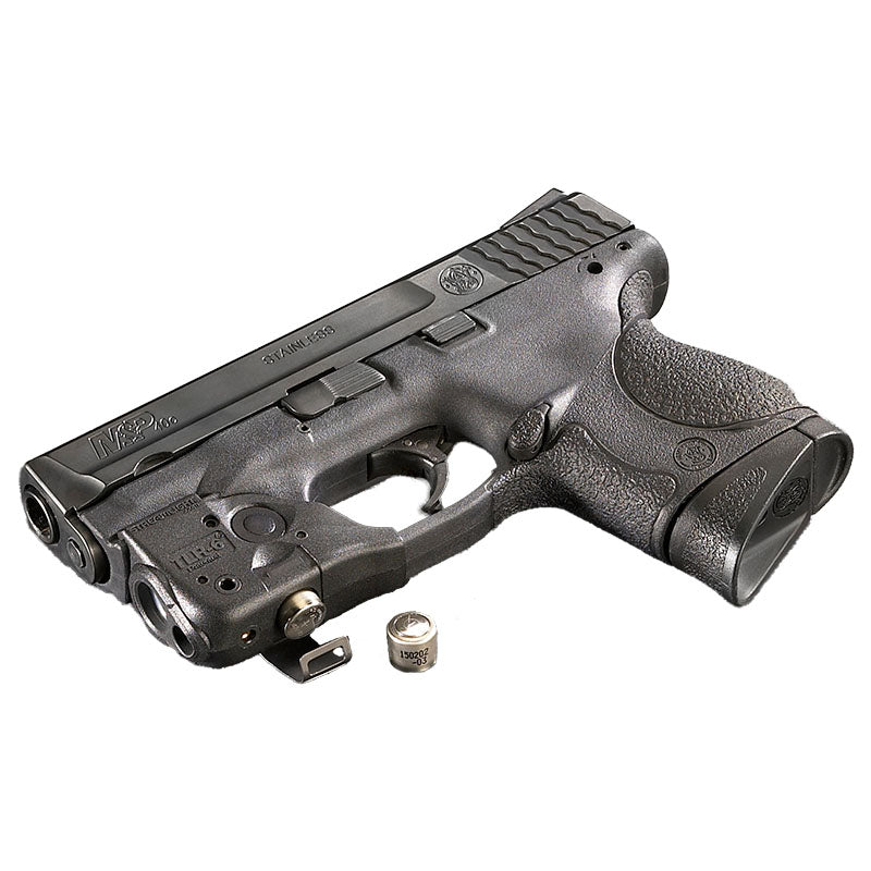 Streamlight TLR-6 rail-mount weapon light with red laser on a pistol gripped in a shooter's hand