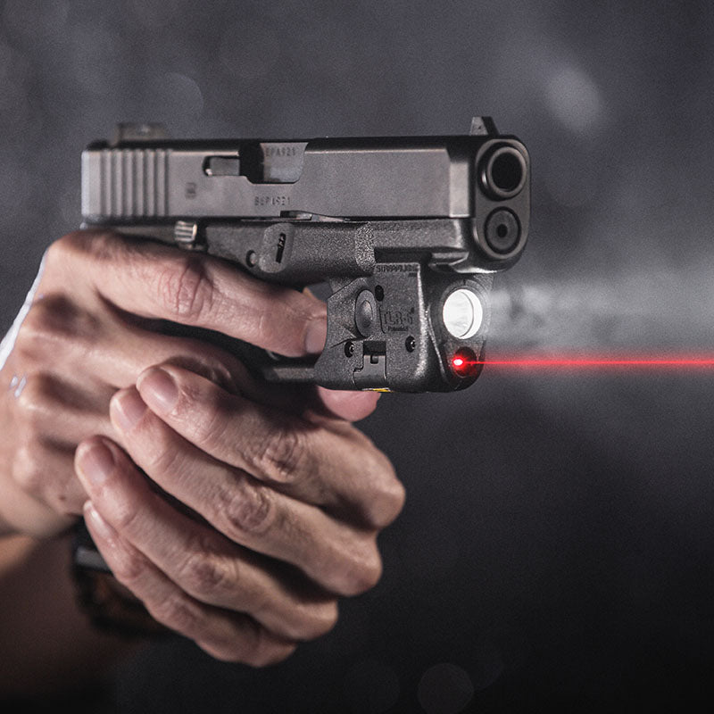 Streamlight TLR-6 rail-mount weapon light with red laser on a Glock pistol in a darkened red-lit scene