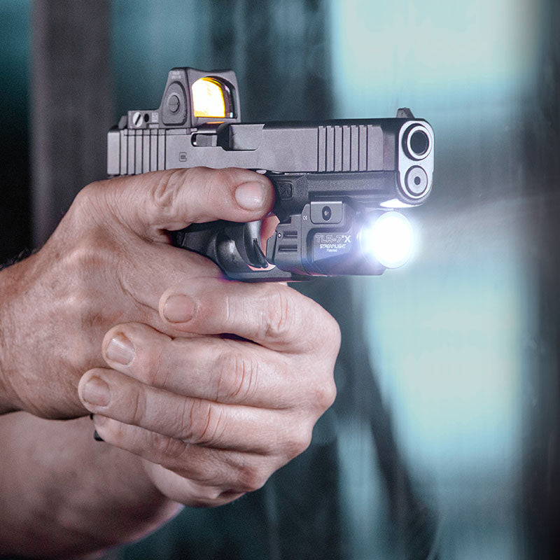 Streamlight TLR-7 X USB weapon light in black mounted on the rail of a Glock pistol